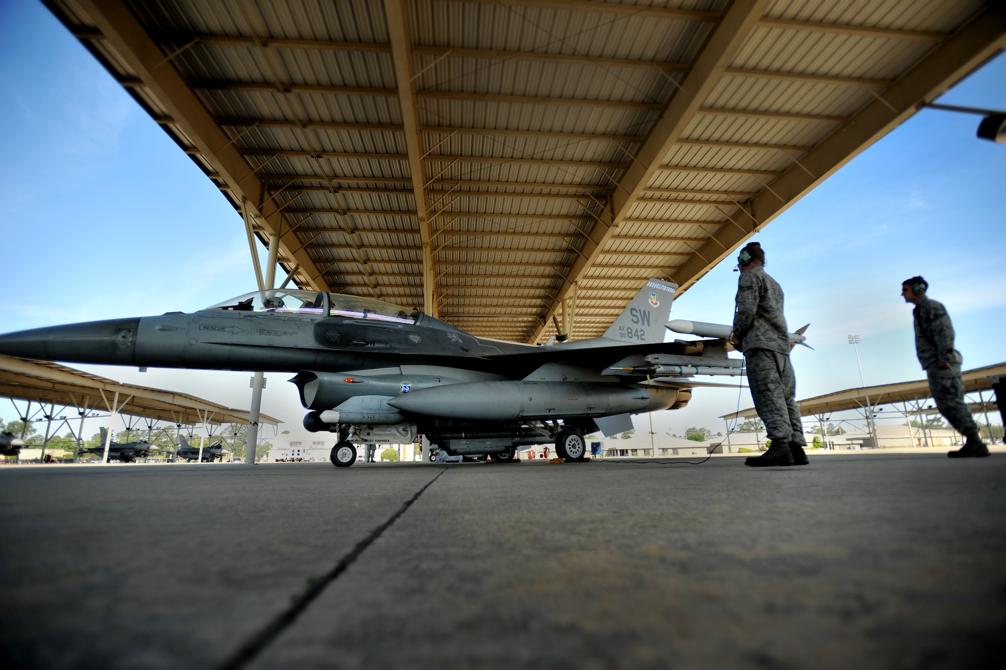 U.S. Air Force crew chiefs assigned to the 20th Aircraft Maintenance Squadron, prepare to launch an F-16 Fighting Falcon, April 13, 2012, Shaw Air Force Base, S.C. Shaw's F-16 Fighting Falcon fleet is the number one asset that aids pilots when providing combat-ready airpower anytime, anywhere. (U.S. Air Force photo by Senior Airman Kenny Holston/Released)


