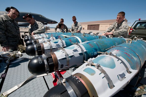 Weapons load crew Airmen assigned to the 28th Aircraft Maintenance Squadron prepare six GBU-54 laser Joint Direct Attack Munitions for loading onto three B-1 bombers during a Combat Hammer exercise at Ellsworth Air Force Base, S.D., May 12, 2012. The goal of the exercise was to evaluate the effectiveness, maintainability, suitability and accuracy of precision-guided munitions and other advanced air-to-ground weapons. (U.S. Air Force photo by Airman 1st Class Zachary Hada/Released)