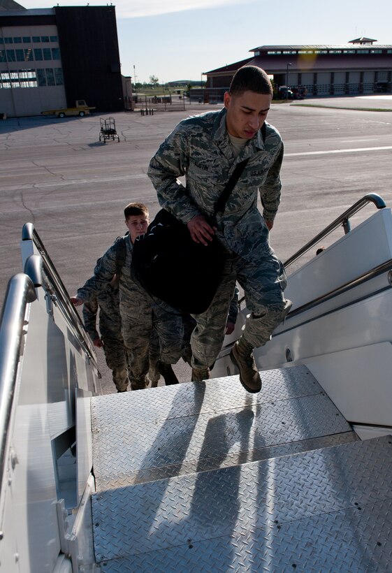 Ellsworth Air Force Base, S.D., Airmen board a commercial aircraft to leave for Green Flag, a combat training exercise at Nellis Air Force Base, Nev., on the flightline of Ellsworth AFB, S.D., May 10, 2012. The focus of Green Flag will be close air support training, in preparation for future combat operations in Southwest Asia. (U.S. Air Force photo by Airman 1st Class Kate Thornton/Released)