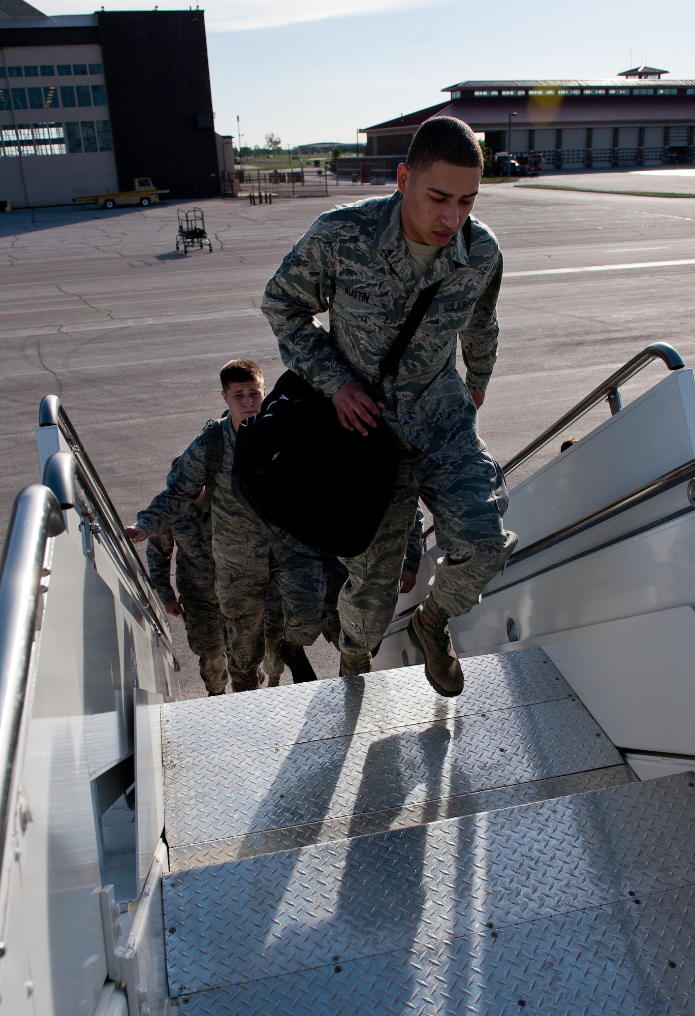 Ellsworth Air Force Base, S.D., Airmen board a commercial aircraft to leave for Green Flag, a combat training exercise at Nellis Air Force Base, Nev., on the flightline of Ellsworth AFB, S.D., May 10, 2012. The focus of Green Flag will be close air support training, in preparation for future combat operations in Southwest Asia. (U.S. Air Force photo by Airman 1st Class Kate Thornton/Released)