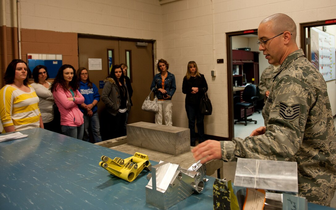 Tech. Sgt. Kenneth Babb, 28th Maintenance Squadron metals technology assistant NCO in charge, explains metals technology to spouses of Airmen assigned to the 28th MXS during Spouse Appreciation Day at Ellsworth Air Force Base, S.D., May 11, 2012. Squadrons around the base organized a wide array of tours and activities designed to thank spouses for all they do and the important role they play in the lives of Airmen. (U.S. Air Force photo by Airman 1st Class Kate Thornton/Released)