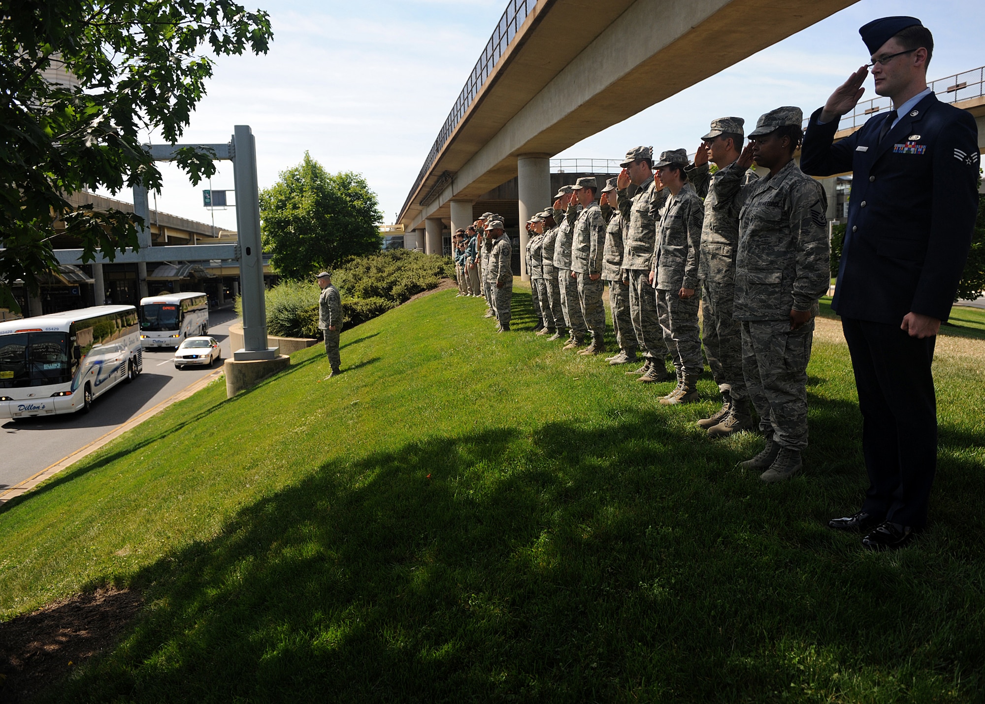 Airmen salute a group of World War II veterans as they depart Ronald Reagan National Airport during their Honor Flight tour May 12. The Honor Flight Network is a nonprofit organization created solely to honor America’s veterans for all their sacrifices. (Air Force photo by Senior Airman Christina Brownlow)
