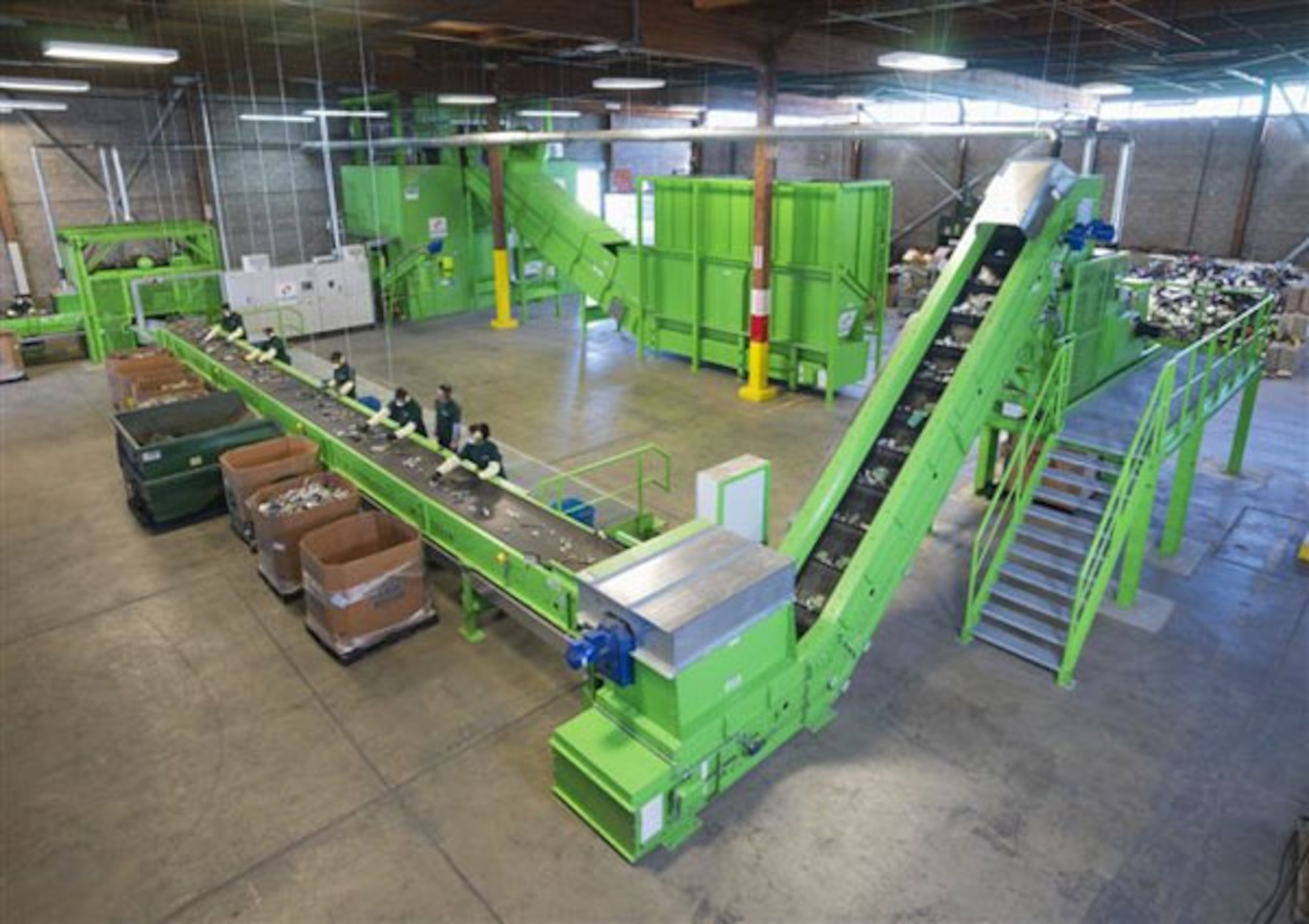 After the “Big Green Machine” dismantles electronics at California Electronic Asset Recovery and a magnet removes steel parts, some of the company’s 70 workers sort larger pieces of non-ferrous metals and plastics.  Sorted parts continue through further automated cleaning processes before recycling.  (Courtesy photo)