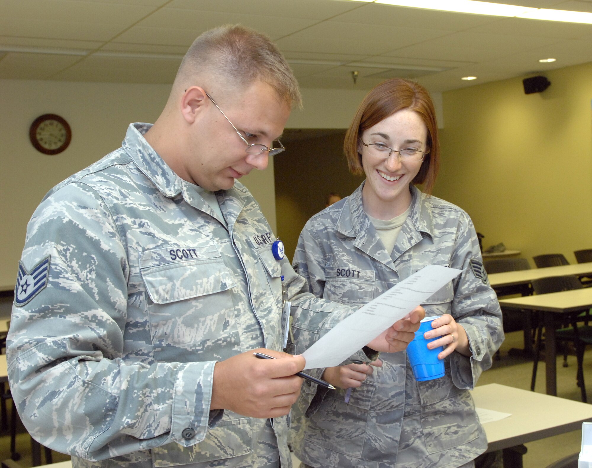 U.S. Air Force Staff Sgt. Samuel Scott, 366th Surgical Squadron, and Staff Sgt. Erica Scott, 366th Aerospace Medical Squadron, work together on a test administered during the 366th Medical Group’s medical Olympics at Mountain Home Air Force Base, Idaho, May 10, 2012. The Olympics were one activity held during the group’s week-long National Nurses Week celebration May 6-12. Other events included an ice cream social, a nurse’s call and a soup contest. (U.S. Air Force photo/Senior Airman Alyssa Wallace)