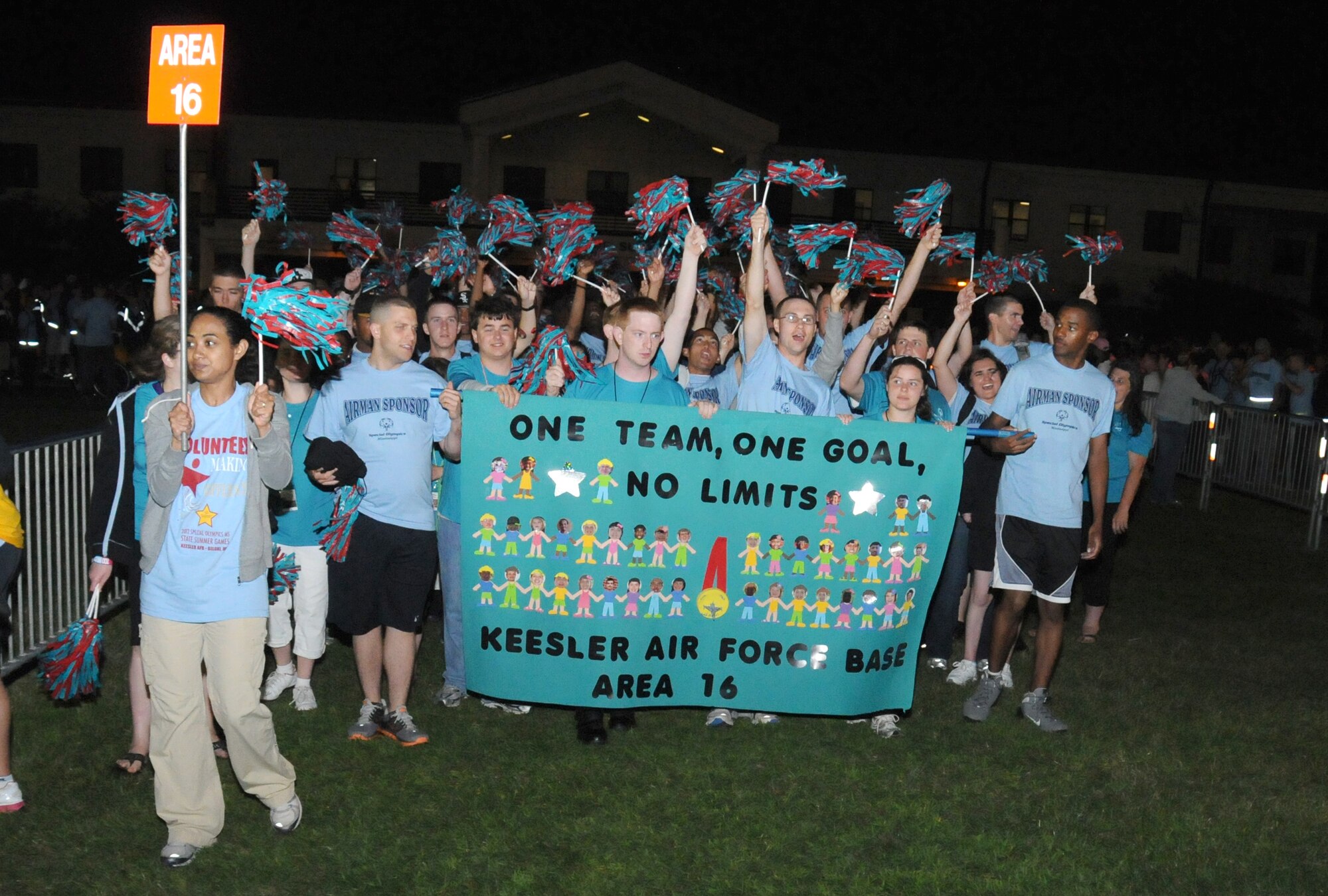 Athletes and their Airmen sponsors arrive at the opening ceremonies of the Special Olympics Mississippi Summer Games, May 11, 2012, at Keesler Air Force Base, Miss. It’s the 26th year that Keesler has hosted the statewide event. Opening ceremonies took place May 11. Athletic competitions took place throughout the day and were followed by a victory dance May 12. More than 1,200 athletes and coaches and 3,000 volunteers joined forces to make the event a success.  (U.S. Air Force photo by Kemberly Groue)