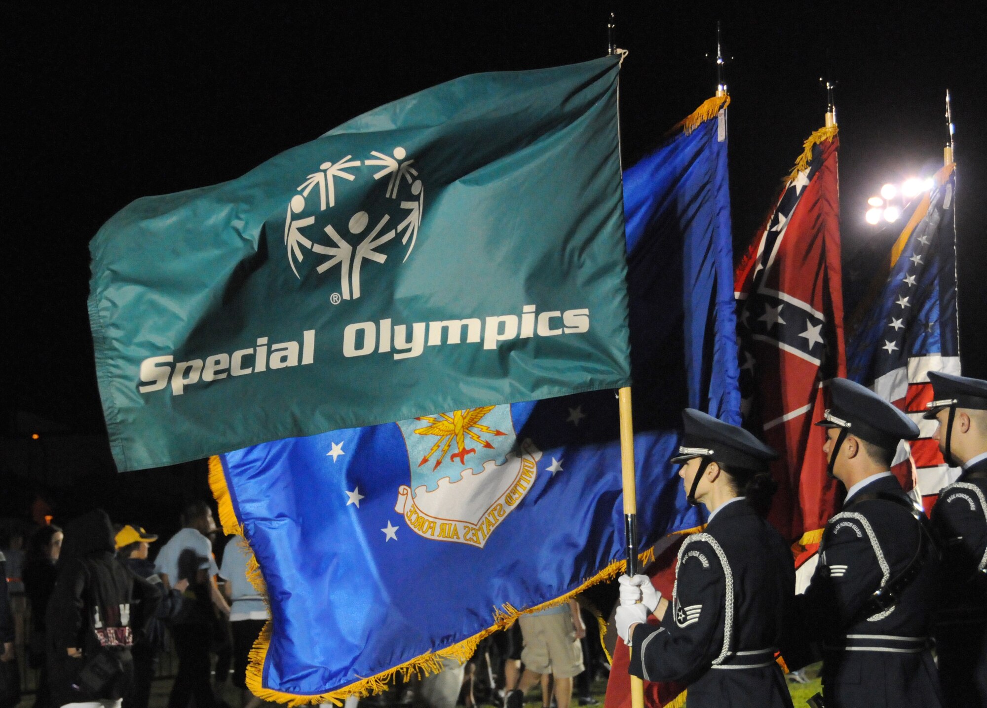 The Keesler Honor Guard stand at attention during the opening ceremonies of the Special Olympics Mississippi Summer Games, May 11, 2012, at Keesler Air Force Base, Miss. It’s the 26th year that Keesler has hosted the statewide event. Opening ceremonies took place May 11. Athletic competitions took place throughout the day and were followed by a victory dance May 12. More than 1,200 athletes and coaches and 3,000 volunteers joined forces to make the event a success.  (U.S. Air Force photo by Kemberly Groue)