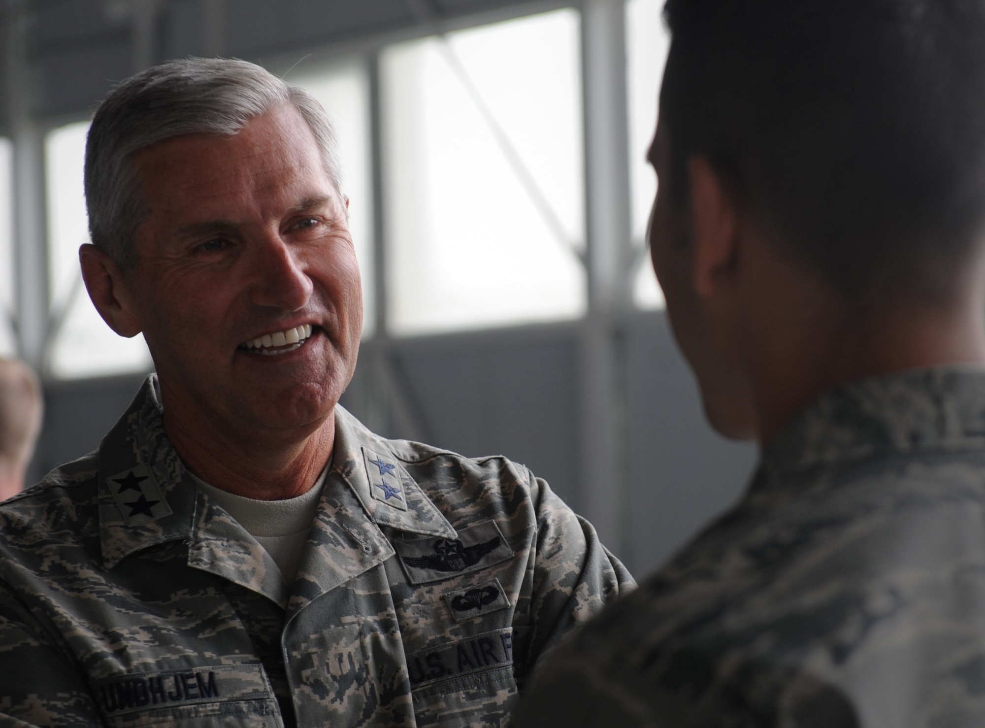 U.S. Air Force Maj. Gen. Lance D. Undhjem, mobilization assistant to the commander, 12th Air Force, Davis-Monthan Air Force Base, Ariz., speaks to an enlisted member during a mission familiarization visit at Mountain Home Air Force Base, Idaho, May 15, 2012. Undhjem received a tour of base facilities ranging from the flightline to the Medical Group. (U.S. Air Force photo/Staff Sgt. Gina Paige)