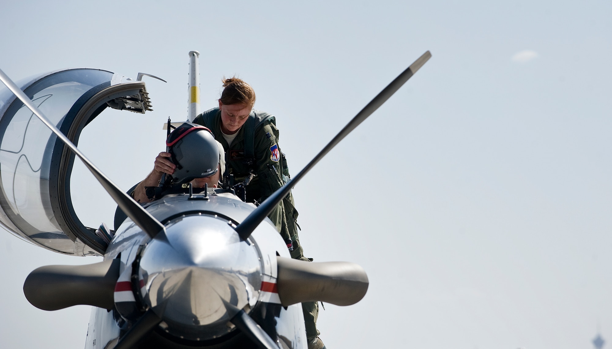 1st. Lt. Kristen Smith, 33rd Flying Training Squadron pilot, Vance Air Force Base, Okla., climbs into a T-6A Texan II, during the Weapons Instructor Course May 8, 2012, at Nellis Air Force Base, Nev. The T-6A Texan II is a 2-seat, tandem, turbo prop aircraft and simulates a lower and slower target for training pilots participating in the WIC. (U.S. Air Force photo by Staff Sgt. Christopher Hubenthal)