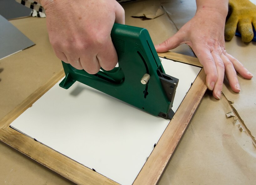 A member of the Arts and Crafts Center demonstrates framing May 9, 2011, at the A&CC on Dover Air Force Base, Del. The A&CC offers framing services for Team Dover members. (U.S. Air Force photo by Adrian R. Rowan)