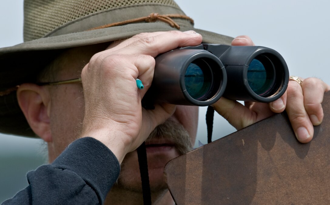 Retired U.S. Air Force Maj. Mark Sopko searches for different bird species during the 2012 Spring Bird Count May 12, at Langley Air Force Base, Va. Since he was 14 years old, Sopko has spotted more than 400 birds throughout the United States and South America. (U.S. Air Force Photo by Senior Airman Stephanie Rubi / Released) 