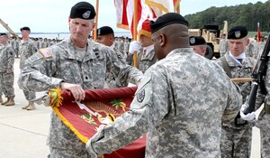 U.S Army Lt. Col. Layton Dunbar, right, and Command Sgt. Maj. Jade James, left, the 24th Transportation Battalion commander and command sergeant major, respectively, case the battalion colors during the 24th Trans. Bn. inactivation ceremony at Fort Eustis' 3rd Port, May 14, 2012. The battalion inactivated after an illustrious service record, having participated in a variety of missions around the globe from World War II to recent engagements in the Middle East. (U.S. Army photo by Sgt. 1st Class Brian Rhodes/Released)