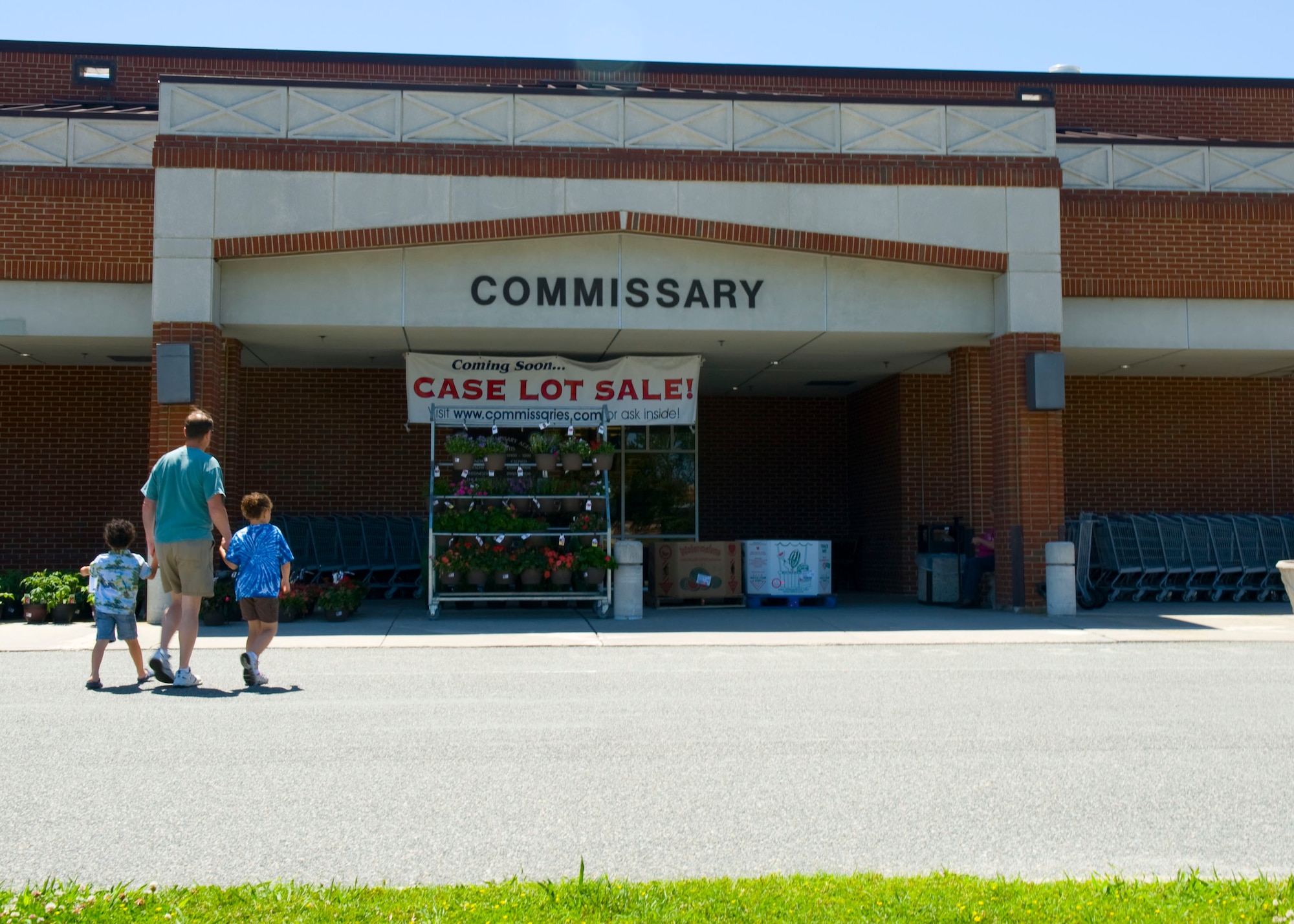 A family walks into the Commissary at Fort Eustis, Va., May 11, 2012. The Ft. Eustis Commissary earned the Best Large Store in the Grocery Merchandising category during the Defense Commissary Agency's Annual Merchandising Awards ceremony at DeCA's headquarters at Fort Lee, Va., May 3. (U.S. Air Force photo by Senior Airman John D. Strong II/Released)