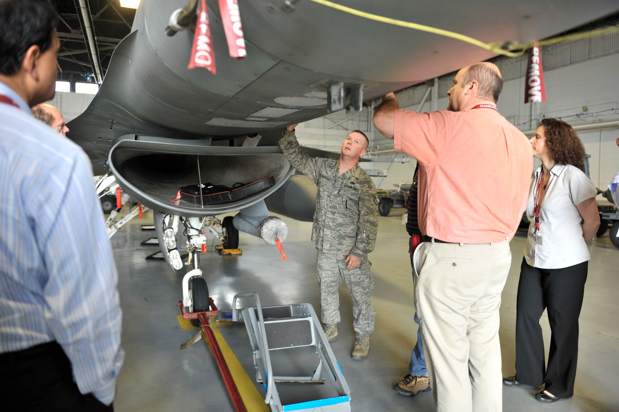 U.S. Air Force Staff Sgt. Daniel Grigg, 20th Maintenance Group lead crew member, shows members of the Carolina Nexus program of the University of South Carolina the exterior of an F-16 at Shaw Air Force Base, S.C., May 14, 2012. Distinguished visitors and members of Carolina Nexus took at five-day bus tour, viewing popular landmarks in South Carolina. (U.S. Air Force photo by Senior Airman Tabatha McCarthy/released)