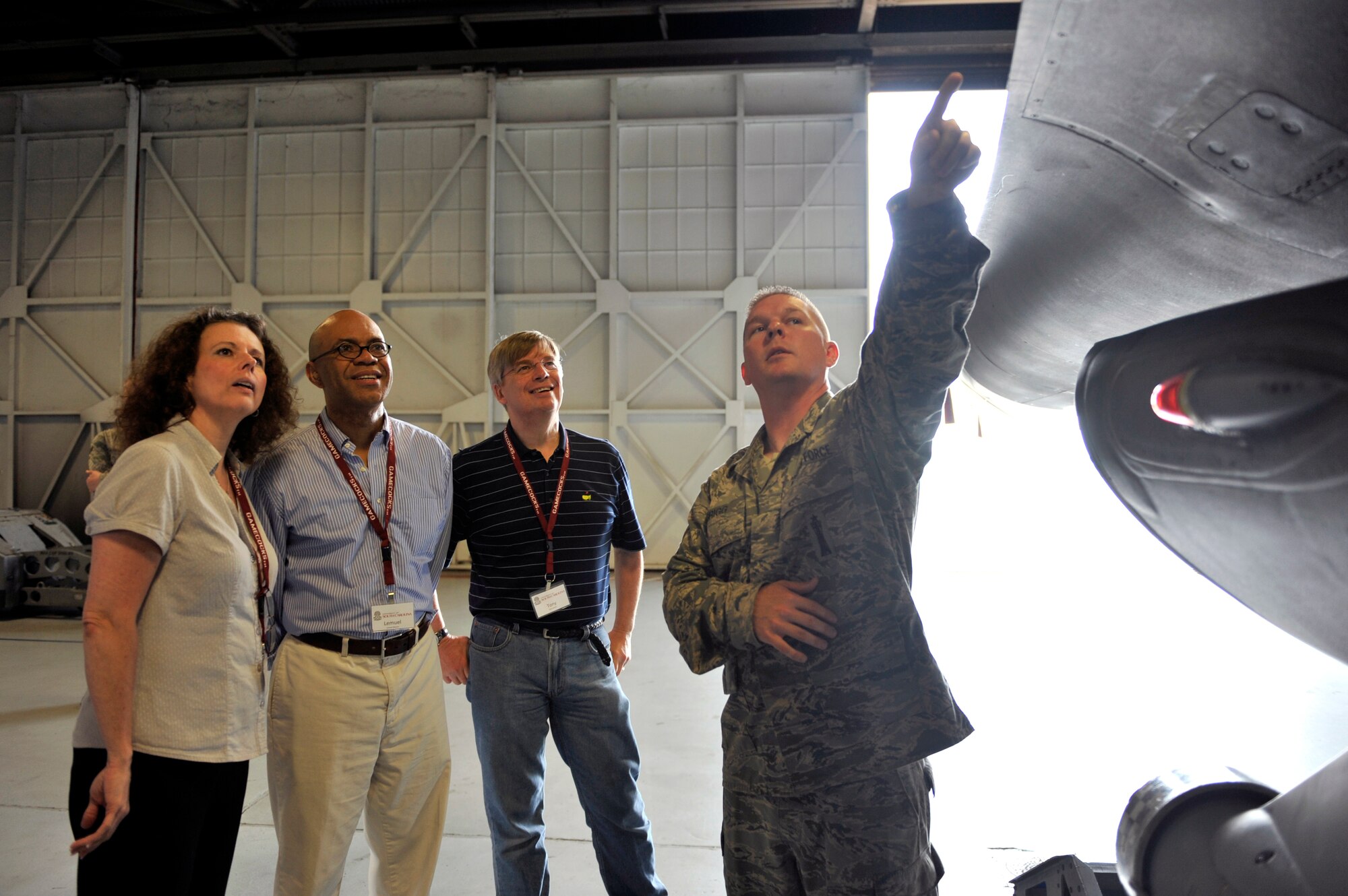 U.S. Air Force Staff Sgt. Daniel Grigg, 20th Maintenance Group lead crew member, shows Anna Scheyett, University of South Carolina dean of social network, Lemuel Watson, USC dean of education, and Tony Ambler, USC dean of engineering and computing, the M61A1 gun system on the side of the F-16 at Shaw Air Force Base, S.C., May 15, 2012. Aproximately 40 USC faculty members, administrators and students of the Carolina Nexus program toured Shaw AFB during a five-day bus tour. The tour showcased what facilities and activities South Carolina has to offer. (U.S. Air Force photo by Senior Airman Tabatha McCarthy/released)