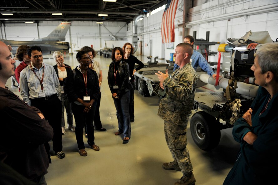 U.S. Air Force Staff Sgt. Daniel Grigg, 20th Maintenance Group lead crew member, speaks to Carolina Nexus members of the University of South Carolina about different missiles and their purposes at Shaw Air Force Base, S.C., May 14, 2012. Carolina Nexus members viewed landmarks throughout South Carolina during the tour. (U.S. Air Force photo by Senior Airman Tabatha McCarthy/released)
