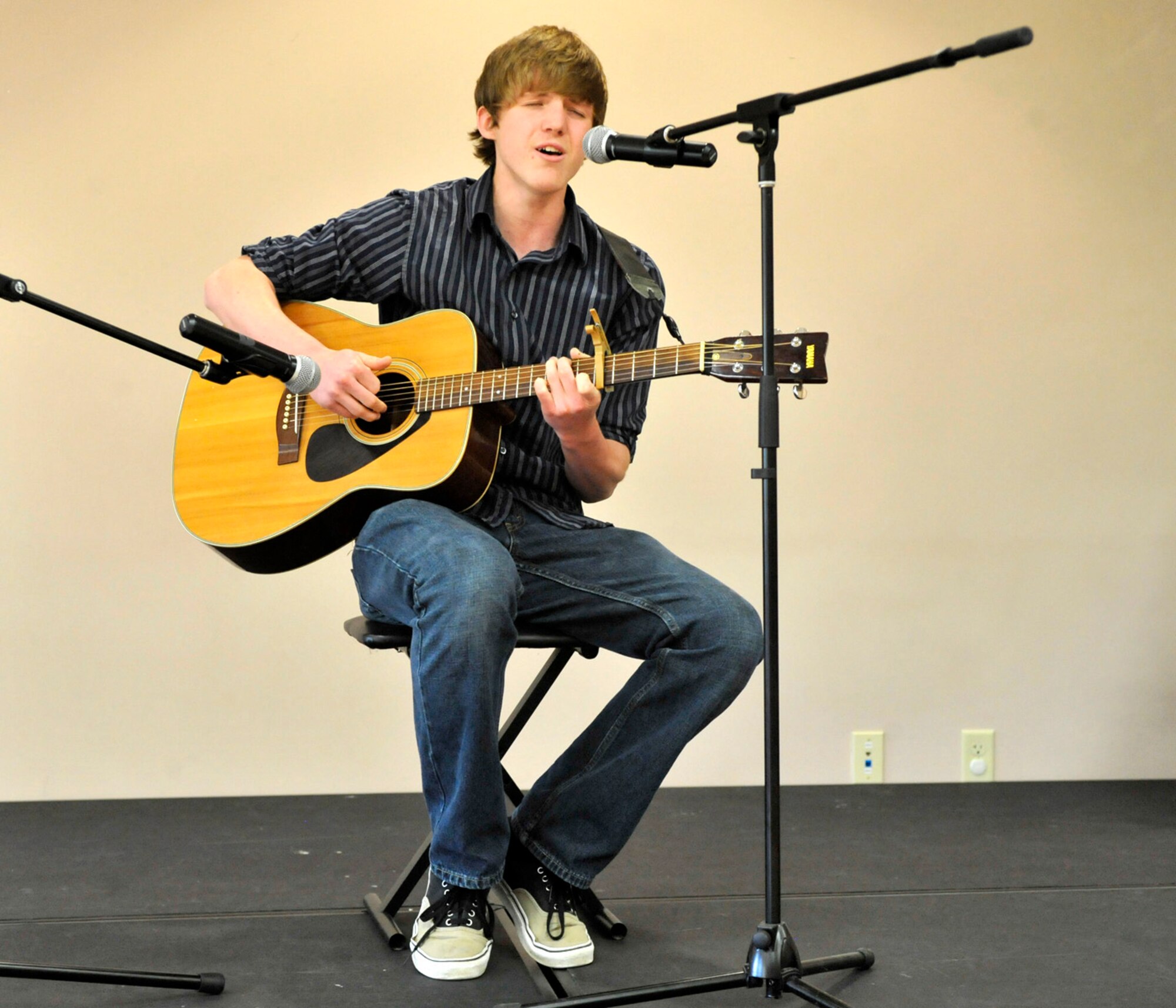Thomas Plummer plays and sings "Feelings for You" during the You Got Talent competition May 11, 2012, at the Youth Center on Dover Air Force Base, Del. Plummer won first place in the 15-18 age group in the instrumental/singing category. (U.S. Air Force photo by Tech. Sgt. Chuck Walker)