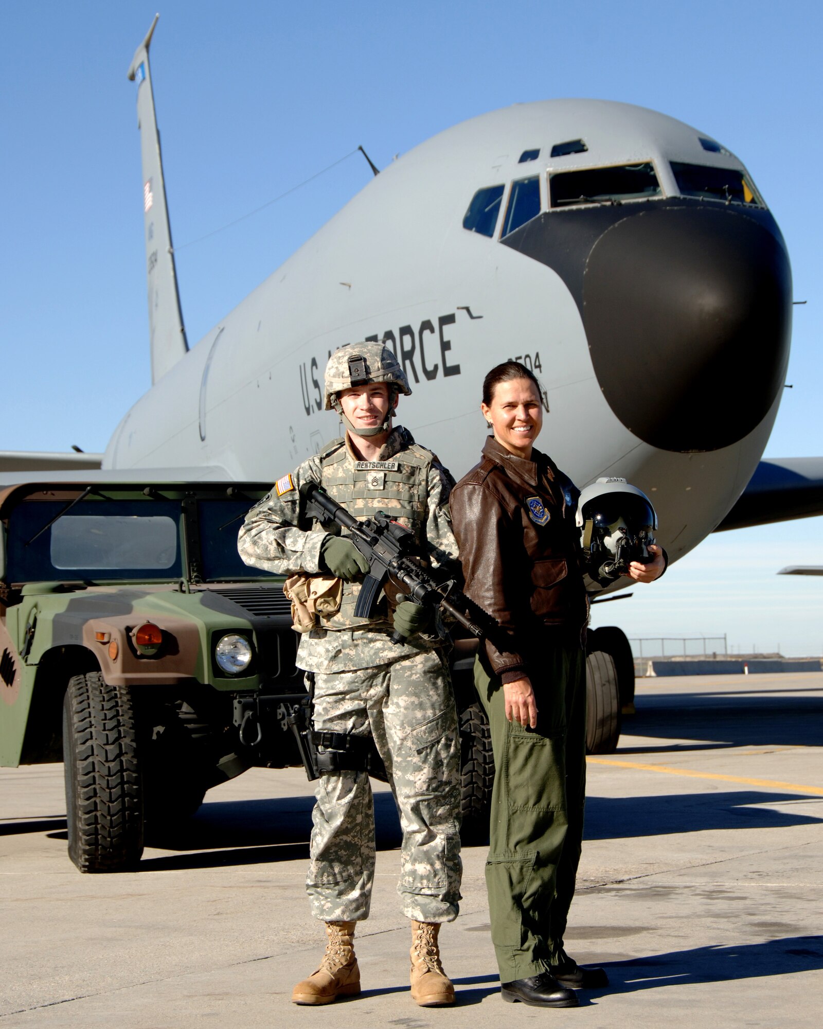 Lt. Col. Lisa Berente, a KC-135 pilot and Chief of Safety for the 151st Air Refueling Wing, poses in front of a KC-135.  Berente was recently featured in "Military Fly Moms," a coffee table book featuring military pilots who are also mothers.  (U.S. Air Force courtesy photo)