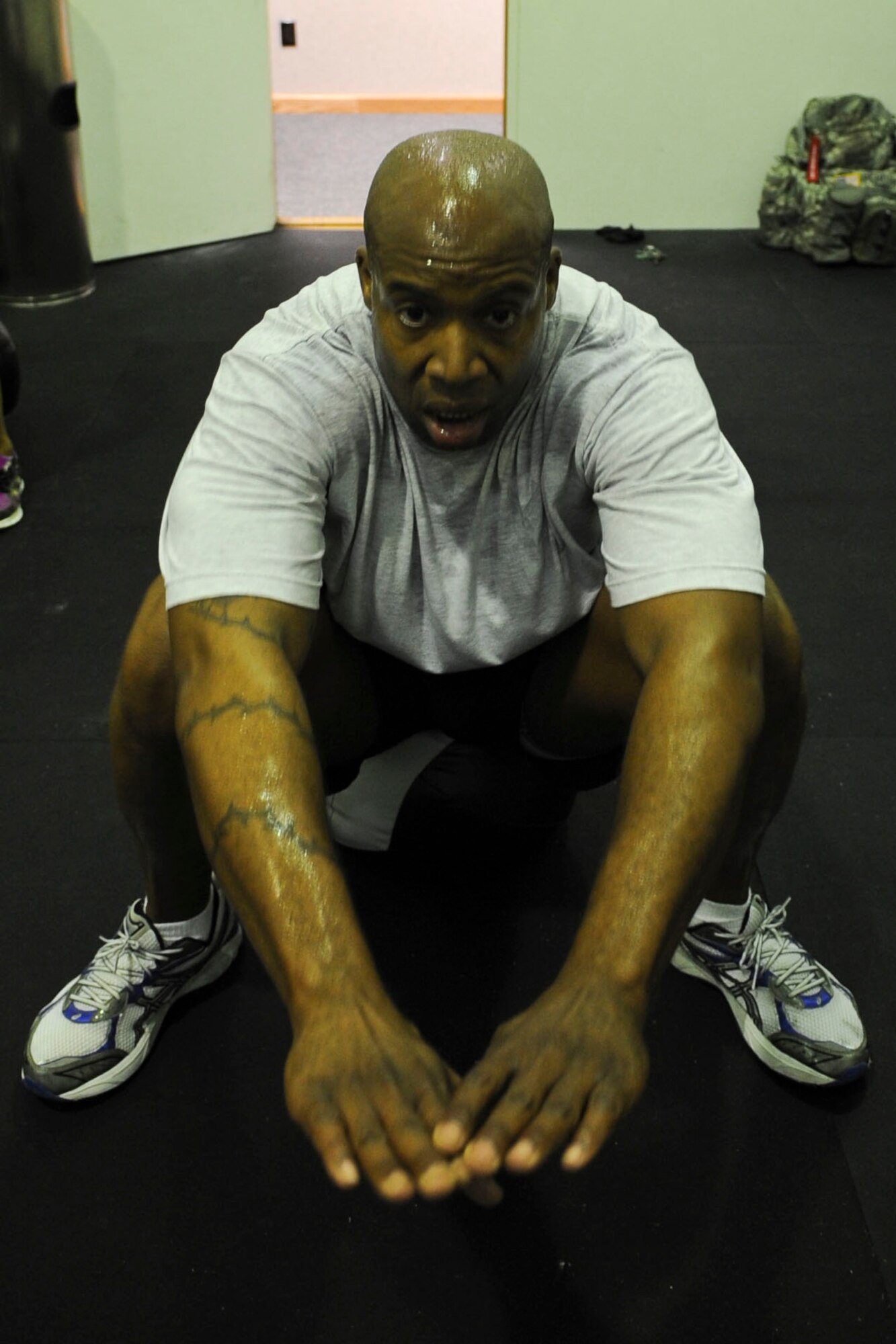 U.S. Air Force Tech. Sgt. Raymar Bowen, 633rd Force Support Squadron manpower superintendent, performs the Crossfit exercise, “Front Squat,” during their unit physical fitness session at the Langley Air Force Base, Va., Air Combat Command gym, May 15, 2012. Bowen, along with nine others, is completing a three-month Crossfit class. (U.S. Air Force photo by Senior Airman Wesley Farnsworth/Released)