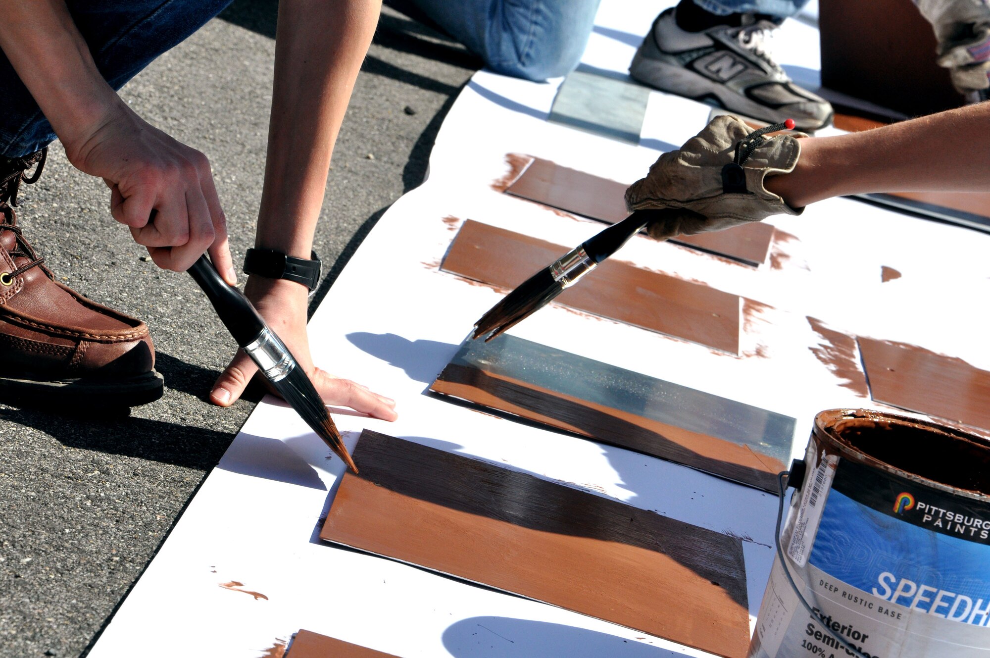 Boy Scouts of America Troop 31 scouts paint signs for placement along the Air Combat Command running trail May 12. Troop 31 is from Fort Monroe; however due to the lack of a Langley Air Force Base troop, Troop 31 volunteered their time to aid the community. The troop supplied some of their own tools for the project, and the 633rd Civil Engineers Squadron provided other necessary materials. (U.S. Air Force photo by Airman 1st Class Austin Harvill/Released) 