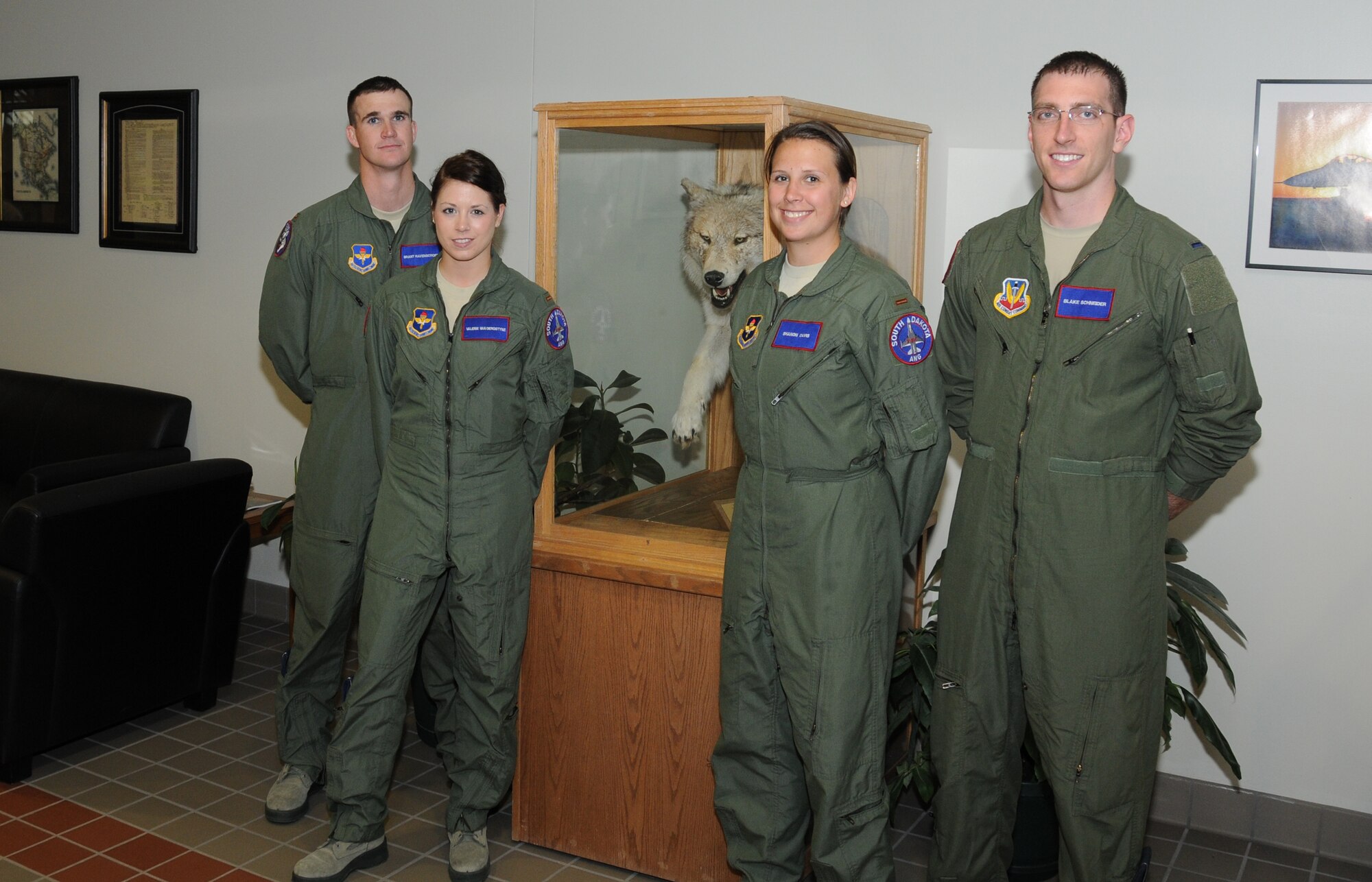 SIOUX FALLS, S.D. - New F-16 pilot candidates for the 175th Fighter Squadron, South Dakota Air National Guard include, left to right; 2nd Lt. Brant Ravenscroft, 2nd Lt. Valerie Vanderostyne, 2nd Lt. Shanon Davis, and 1st Lt. Blake Schneider.  The new "Lobos" will be attending Undergraduate Pilot Training over the next 13 months and amongst them is the unit's first two female F-16 pilots. (National Guard photo by Master Sgt. Christopher Stewart)(Released)