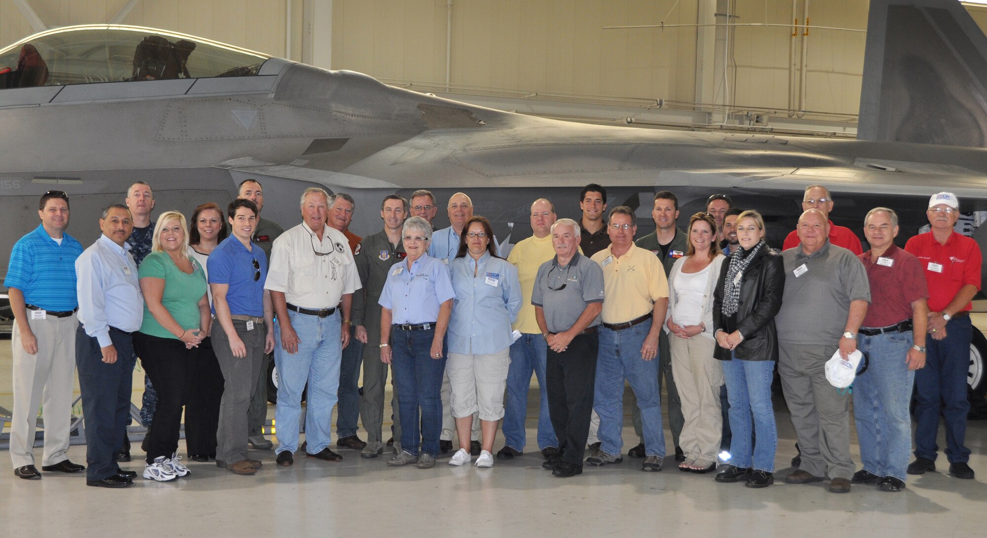 Participants and military members pose for a photo in front of an F-22 Raptor from the 192nd Fighter Wing at Langley Air Force base, Va., May 10, during the 2012 ESGR Joint Bosslift. The group learned about Reservists and their role in military operations during the two-day trip. (U.S. Air Force photo/SrA Melissa Harvey)