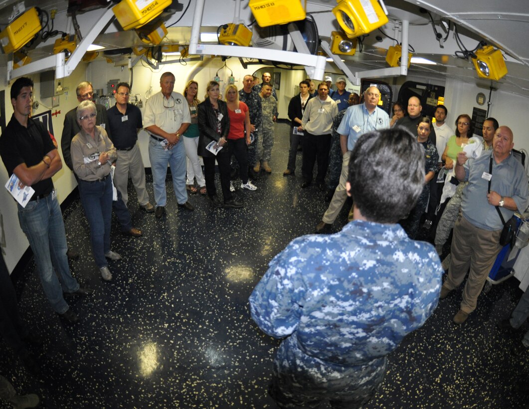 Participants and military members learn about life aboard a ship during a tour of the USS Kearsarge (LHD-3) at Naval Station Norfolk, Va., May 9. The tour was part of the 2012 ESGR Joint Bosslift. The group learned about Reservists and their role in military operations during the two-day trip. (U.S. Air Force photo/SrA Melissa Harvey)