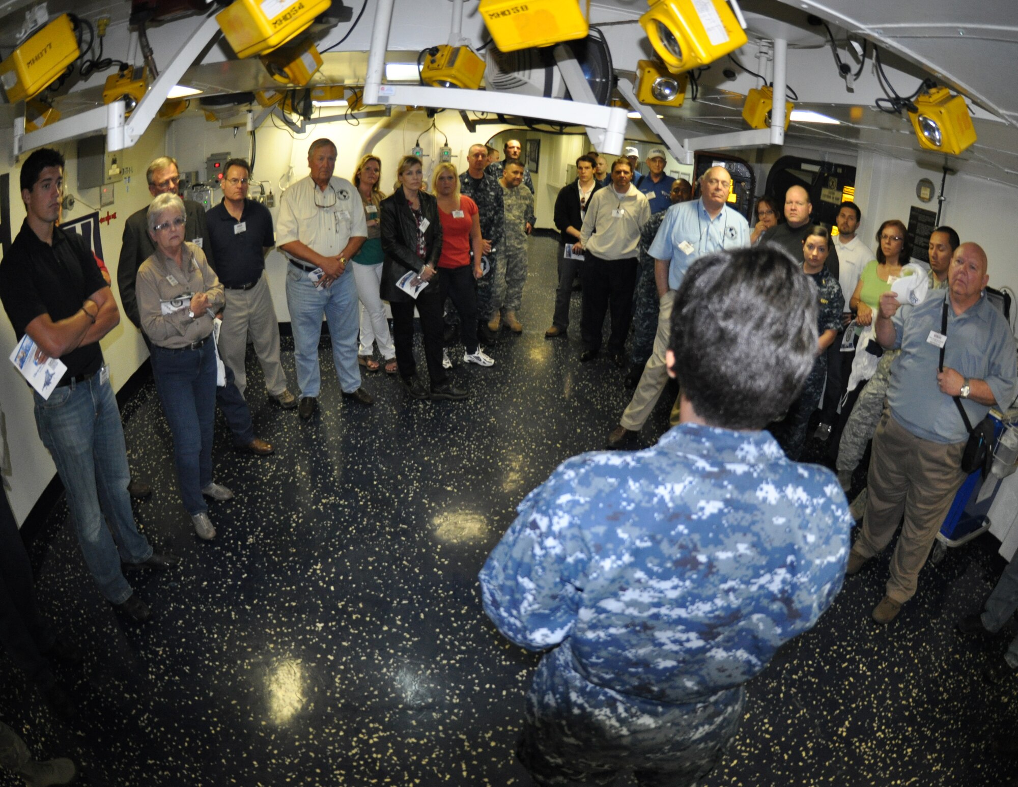 Participants and military members learn about life aboard a ship during a tour of the USS Kearsarge (LHD-3) at Naval Station Norfolk, Va., May 9. The tour was part of the 2012 ESGR Joint Bosslift. The group learned about Reservists and their role in military operations during the two-day trip. (U.S. Air Force photo/SrA Melissa Harvey)