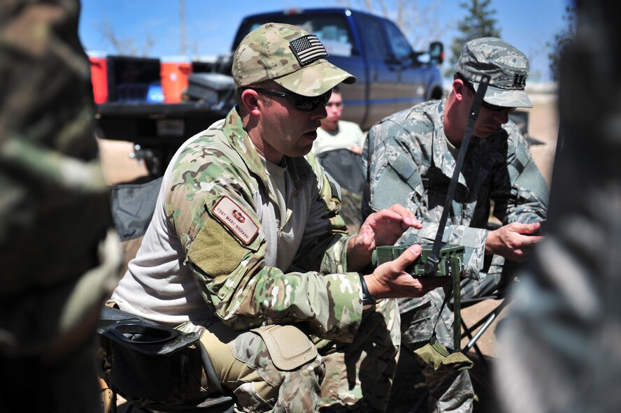 U.S. Air Force Tech. Sgt. Marc Richard, 27th Special Operations Support Squadron Survival Escape Resistance Evasion specialist, shows proper utilization of communication radios at Melrose Air Force Range, N.M., May 3, 2012. Aircrew members spent the day at the range learning critical SERE field training skills. (U.S. Air Force photo by Airman 1st Class Alexxis Pons Abascal)  