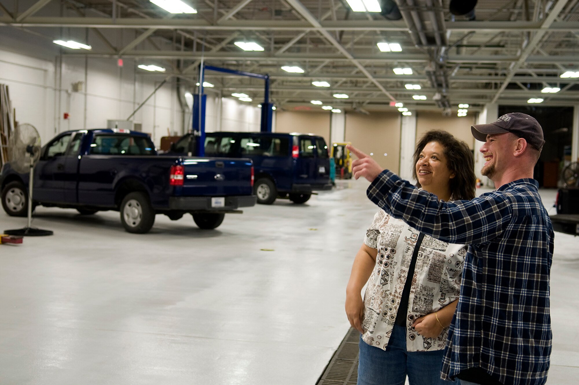 GRISSOM AIR RESERVE BASE, Ind. -- Jacqueline Mantravadi and Damon Spradlin, both with the Grissom bioenvironmental engineering services office, admire all the upgrades made to the base's newly renovated vehicle maintenance facility May 10. The building was first built in 1957 and was in desperate need of modernization. (U.S. Air Force photo/Tech. Sgt. Mark R. W. Orders-Woempner)
