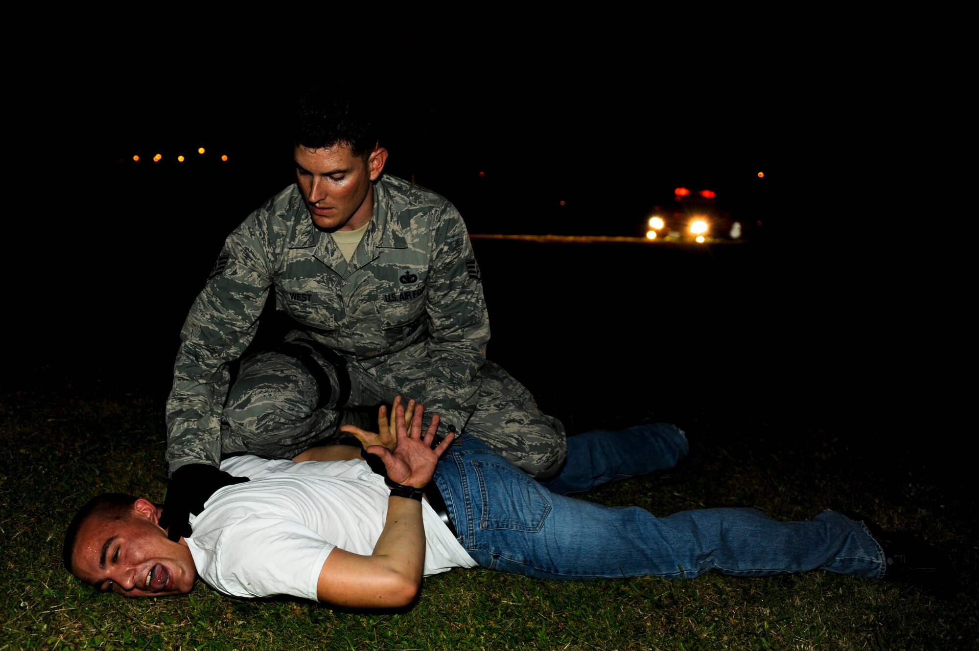 U.S. Air Force Staff Sgt. Robert West, 18th Security Forces Squadron response force leader, conducts a search of U.S. Air Force Airman 1st Class Andrew Chilcoat, 733rd Air Mobility Squadron air freight specialist, for contraband during local operational readiness exercise Beverly High 12-4 on Kadena Air Base, Japan, May 14, 2012. LOREs test Kadena's Airmen on their ability to survive and operate in a multitude of scenarios in order to prepare them for real world contingencies. (U.S. Air Force photo/Airman 1st Class Maeson L. Elleman)