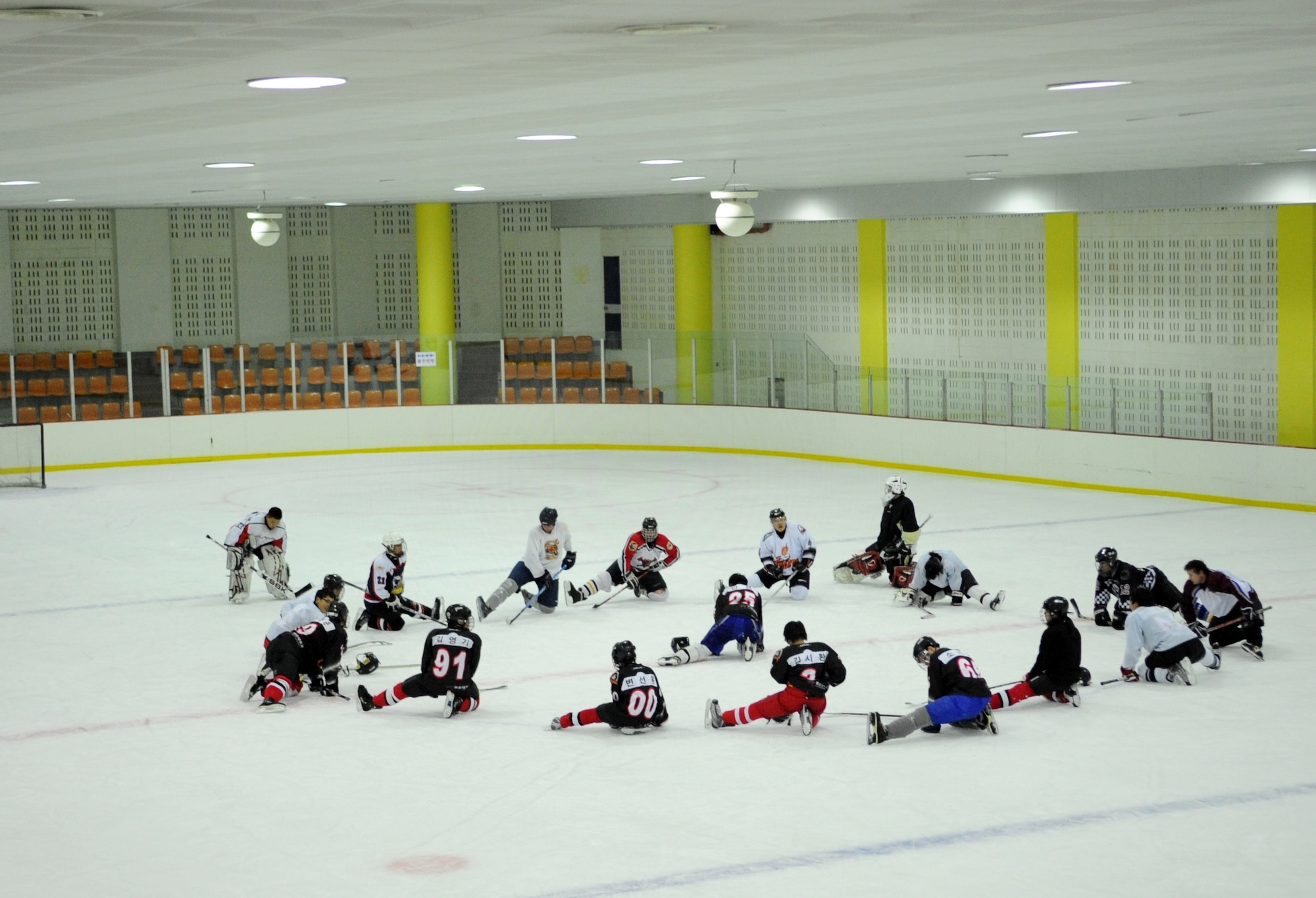 Airmen from Kunsan Air Base stretch out with their South Korean and Canadian teammates after a long practice and scrimmage May 13, 2012, in Jeonju, South Korea. The weekly session helps Koreans and Americans keep their skills sharp while also building community relationships. (U.S. Air Force photo/Senior Airman Brigitte N. Brantley)