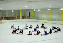 Airmen from Kunsan Air Base stretch out with their South Korean and Canadian teammates after a long practice and scrimmage May 13, 2012, in Jeonju, South Korea. The weekly session helps Koreans and Americans keep their skills sharp while also building community relationships. (U.S. Air Force photo/Senior Airman Brigitte N. Brantley)