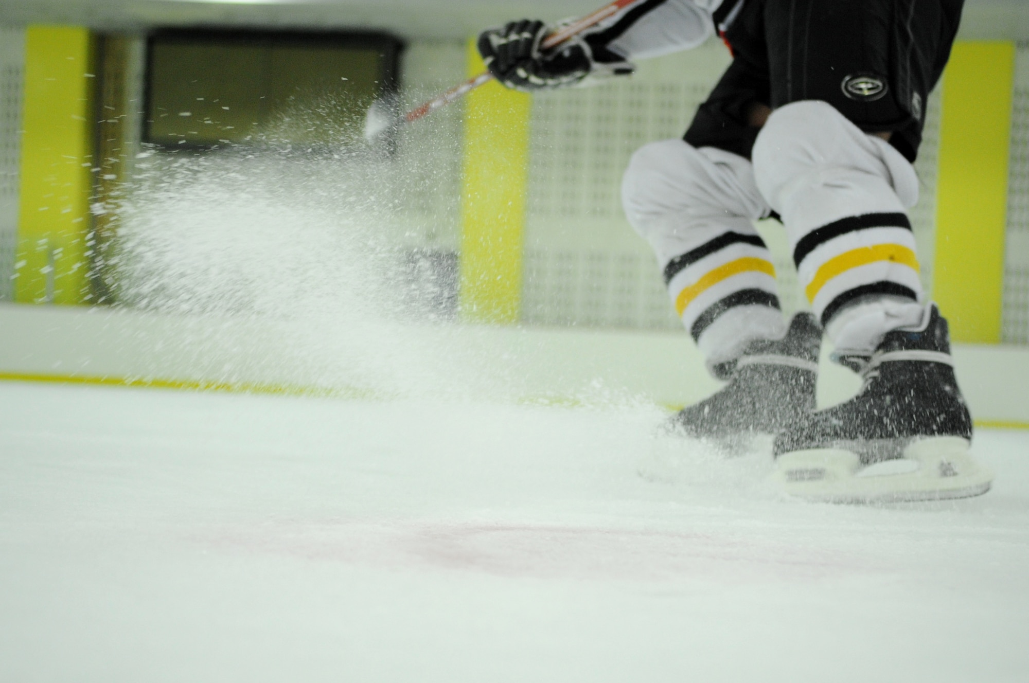 Staff Sgt. Gianpierre Salazar, 8th Civil Engineer Squadron firefighter, executes a tight turn after practice May 13, 2012, in Jeonju, South Korea. Speed, agility and precision are important skills needed to be a good hockey player. (U.S. Air Force photo/Senior Airman Brigitte N. Brantley)