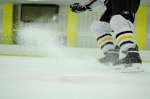Staff Sgt. Gianpierre Salazar, 8th Civil Engineer Squadron firefighter, executes a tight turn after practice May 13, 2012, in Jeonju, South Korea. Speed, agility and precision are important skills needed to be a good hockey player. (U.S. Air Force photo/Senior Airman Brigitte N. Brantley)