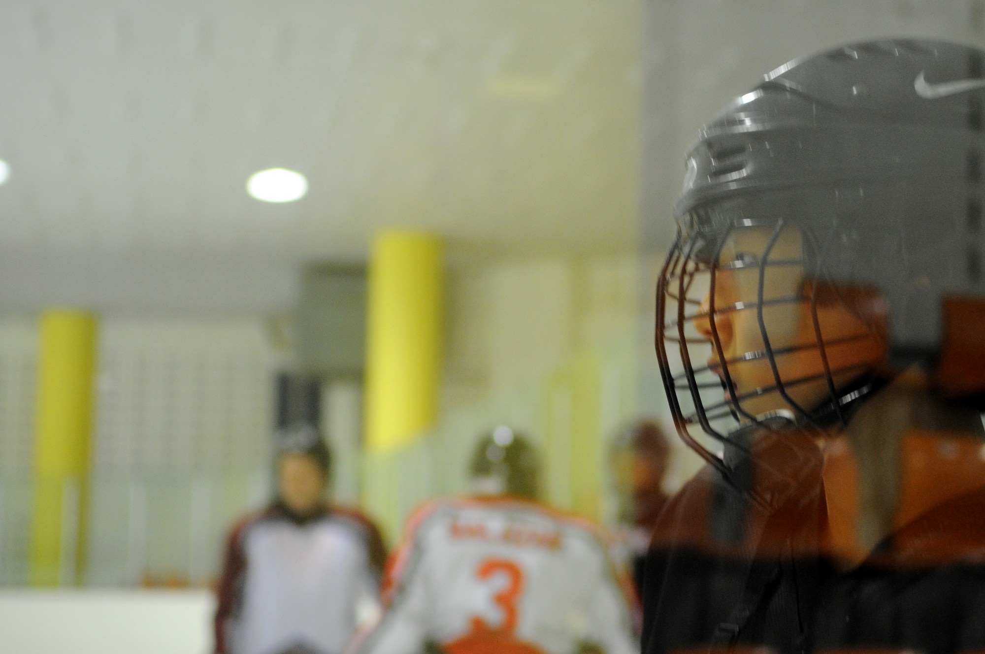A South Korean hockey player watches for the puck during practice with Airmen from Kunsan Air Base May 13, 2012, in Jeonju, South Korea. Although some Koreans speak English well enough to communicate with the Airmen, much is conveyed through hand gestures. (U.S. Air Force photo/Senior Airman Brigitte N. Brantley)