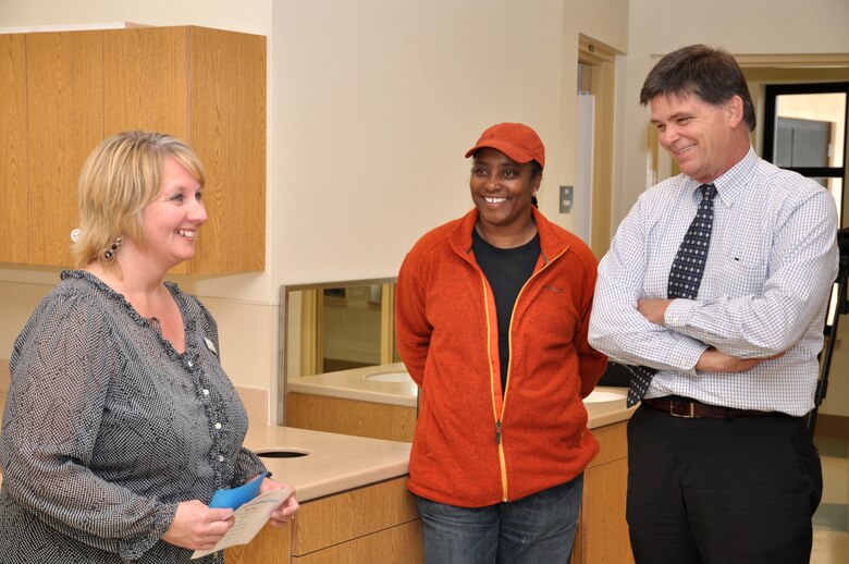 Tricia Collins (left) a program technician with the Child Development Center briefs Valencia Wynn the project's construction representative and John Keever, chief of the Los Angeles District Construction Division during a tour of the new CDC May 11. Infants from six weeks, pre-toddler, toddler and pre-school children enjoy rooms, furnishings and outdoor play areas that are age appropriate in design and features.