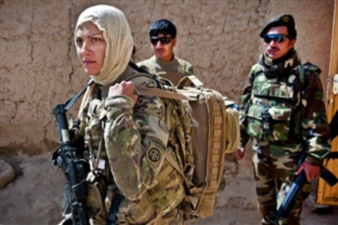 U.S. Army Pfc. Kristina Batty dons a headscarf to meet with female Afghan villagers in Afghanistan's southern Ghazni province, May 5, 2012. Batty, a medic for a female engagement team, is assigned to the 82nd Airborne Division’s 1st Brigade Combat Team.
