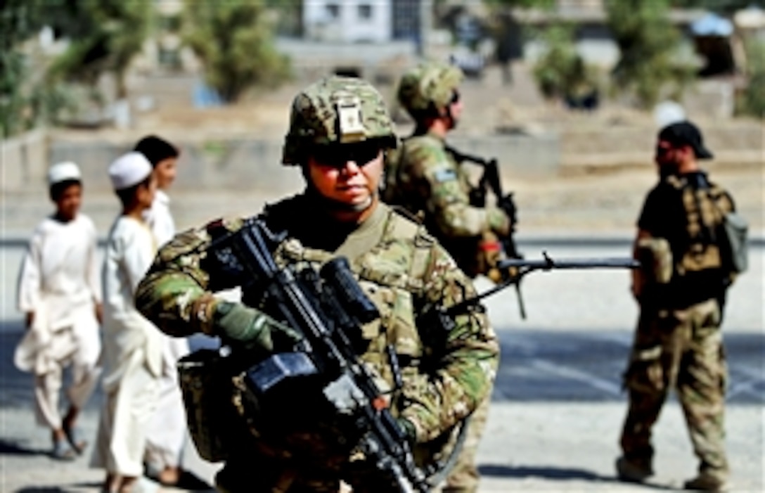 U.S. Army Spc. Terry Proud pulls security during a mission in Farah City in Afghanistan's Farah province, May 12, 2012. Proud is assigned to Provincial Reconstruction Team Farah, whose members met with Farah City citizens to gather information and opinions about the living conditions there.