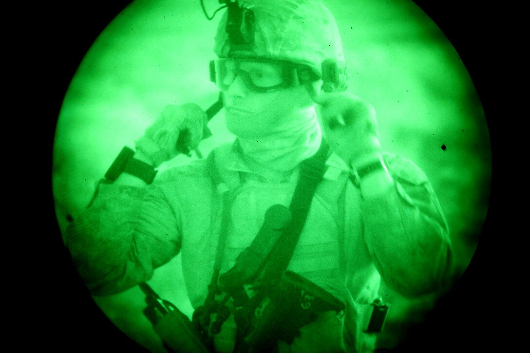 Captain Mathew K. Lesnowicz, commander, Maritime Raid Force, 15th Marine Expeditionary Unit, prepares to conduct a raid in the Chocolate Mountains, Calif., May 15.  The mission was to capture a high-value individual who was reported to be a key leader of a local terrorist organization during the ground portion of Realistic Urban Training.