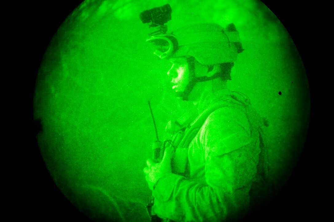 Sergeant Nathan E. Moser, joint terminal attack controller, 1st Air Naval Gunfire Liaison Company Detachment, 15th Marine Expeditionary Unit, establishes communications with aircraft, which will provide close air support and surveillance of the objective for the raid the unit’s Maritime Raid Force is conducting in the Chocolate Mountains, Calif., May 15. The mission was to capture a high-value individual who was reported to be a key leader of a local terrorist organization during the ground portion of Realistic Urban Training. Moser, 23, is from Chesterfield, Va.