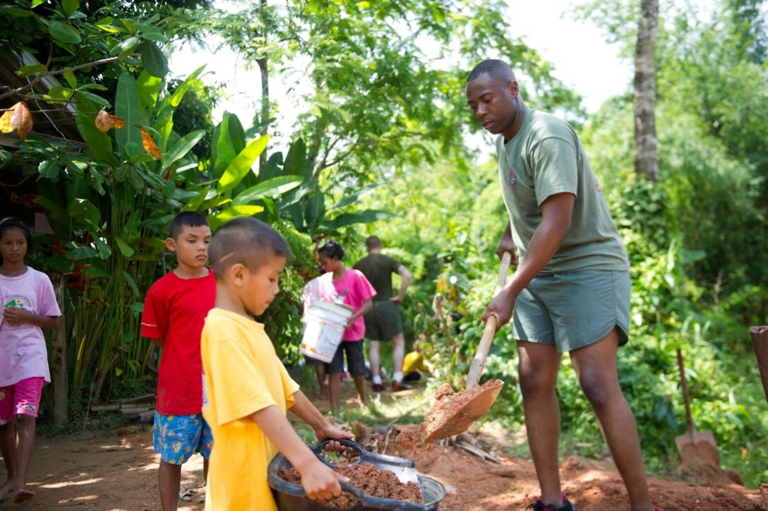 Gunnery Sgt. Miller Daceus shovels dirt during a volunteer project at an orphanage here May 15. Daceus hails from Del Rey Beach, Fla., and serves as the administrative chief for Combat Logistics Battalion 11, which provides logistics and services for the 11th Marine Expeditionary Unit. The unit embarked the ship, as well as USS Makin Island and USS New Orleans in San Diego Nov. 14, beginning a seven-month deployment to the Western Pacific, Horn of Africa and Middle East regions.