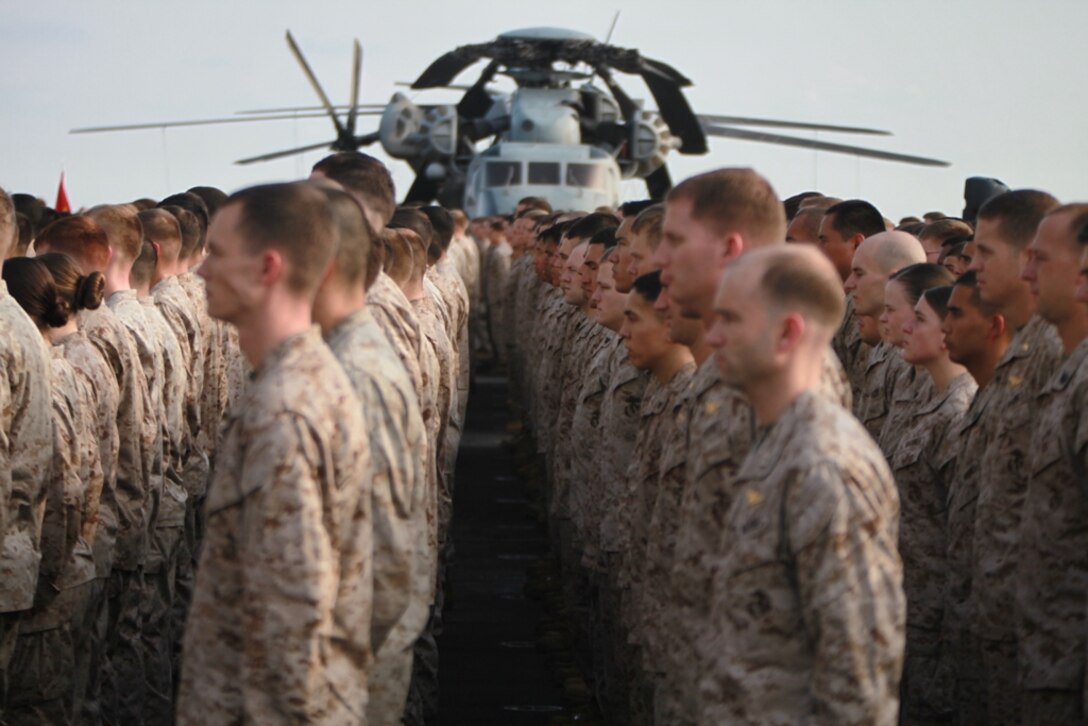 Marines and sailors serving with the 11th Marine Expeditionary Unit aboard USS Makin Island attend a ceremony commemorating the ship’s equator crossing May 14. The Marines serve with the 11th Marine Expeditionary Unit, which embarked the ship, as well as USS New Orleans and USS Pearl Harbor in San Diego Nov. 14, beginning a seven-month deployment to the Western Pacific, Horn of Africa and Middle East regions.