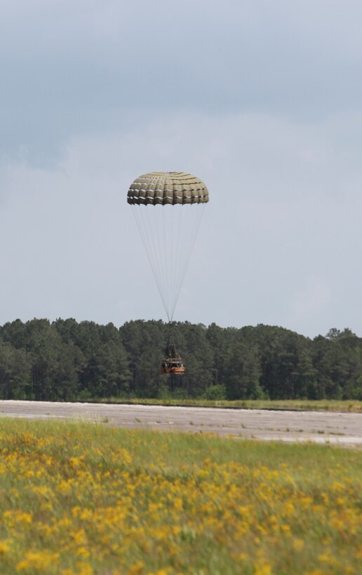 A Container Delivery System bundle lands soon after being parachuted from a MV-22 Osprey, part of the Marine Medium Tiltrotor Squadron 162, 2nd Marine Aircraft Wing, during a training exercise aboard Camp Lejeune, N.C., May 16, 2012.  Marines with Air Delivery Platoon, 2nd Marine Logistics Group assembled eight 520-pound CDS bundles as part of the exercise.