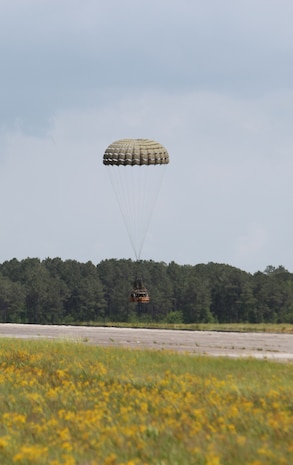 A Container Delivery System bundle lands soon after being parachuted from a MV-22 Osprey, part of the Marine Medium Tiltrotor Squadron 162, 2nd Marine Aircraft Wing, during a training exercise aboard Camp Lejeune, N.C., May 16, 2012.  Marines with Air Delivery Platoon, 2nd Marine Logistics Group assembled eight 520-pound CDS bundles as part of the exercise.