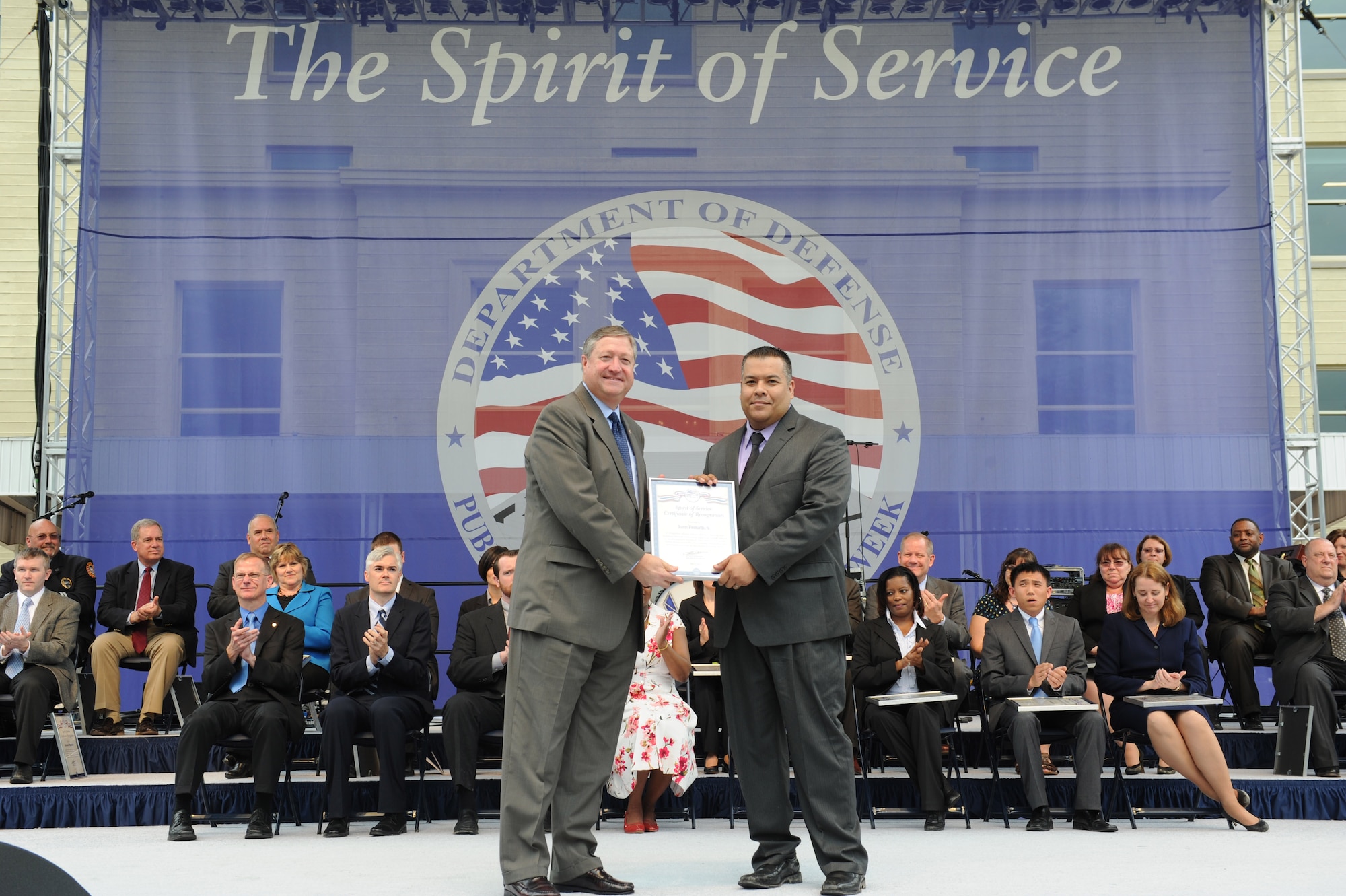 Air Force District of Washington’s Brian K. Halston, contracting, accepts a certificate from the Secretary of the Air Force Michael B. Donley for the Department of Defense Spirit of Service Recognition Award to acknowledge his outstanding service during an awards ceremony at the Pentagon, May 9.  The award honors DOD civilian employees from the National Capital Region who display core qualities of Honor, Integrity and Excellence in their everyday support to the Department.  (Courtesy Photo)