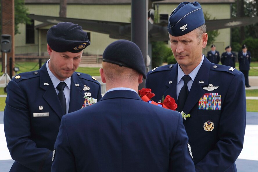 U.S. Air Force Col. Billy Thompson, 23d Wing commander, and Maj. Justin Secrest, 23d Security Forces Squadron commander, receive a wreath in honor of Police Week at President George W. Bush Air Park, Moody Air Force Base, Ga., May 15, 2012. The memorial began in 1982 as a gathering in Washington, D.C., at Senate Park of approximately 120 survivors and supporters of law enforcement. (U.S. Air Force photo by Staff Sgt. Ciara Wymbs/Released)