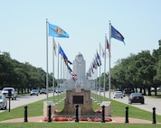 Visitors and newcomers to Joint Base San Antonio-Randolph are greeted by the flags of all 50 states and the base landmark  "Taj Mahal".  (U.S. Air Force photo by Rich McFadden) 