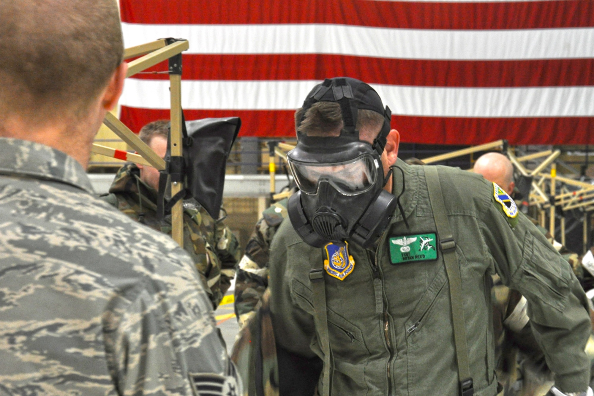 JOINT BASE ELMENDORF-RICHARDSON -- Tech. Sgt Bryan Reed removes his chemical gear top after finishing the Ability to Survive and Operate training program., April 16. Reed is preparing for (U.S. Air Force photo/ Airman 1st Class Omari Bernard)