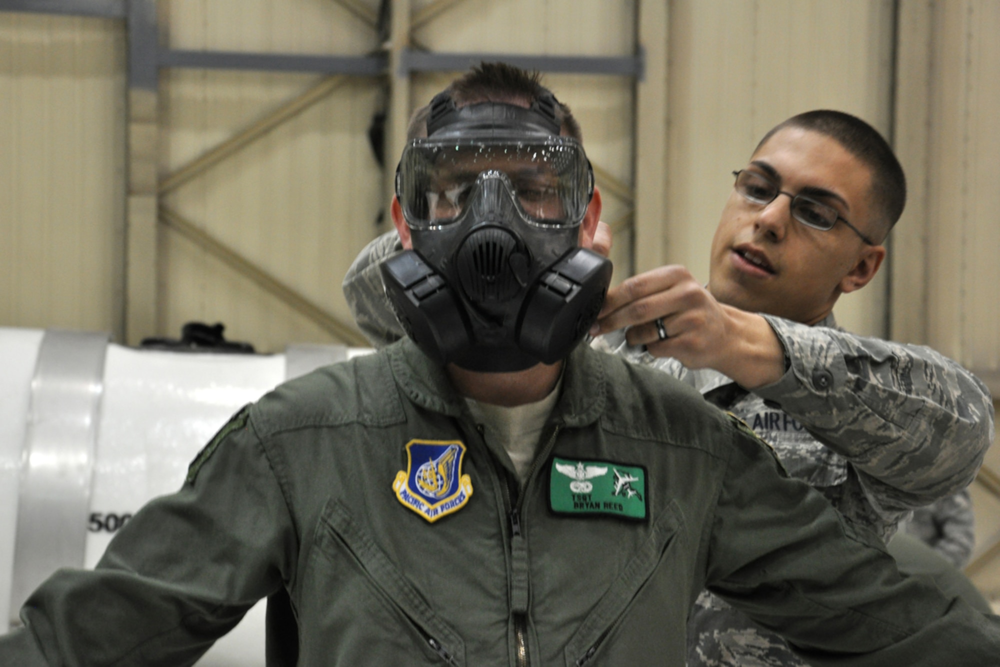JOINT BASE ELMENDORF-RICHARDSON -- Tech. Sgt Bryan Reed removes his chemical gear top after finishing the Ability to Survive and Operate training program., April 16. Reed is preparing for (U.S. Air Force photo/ Airman 1st Class Omari Bernard)