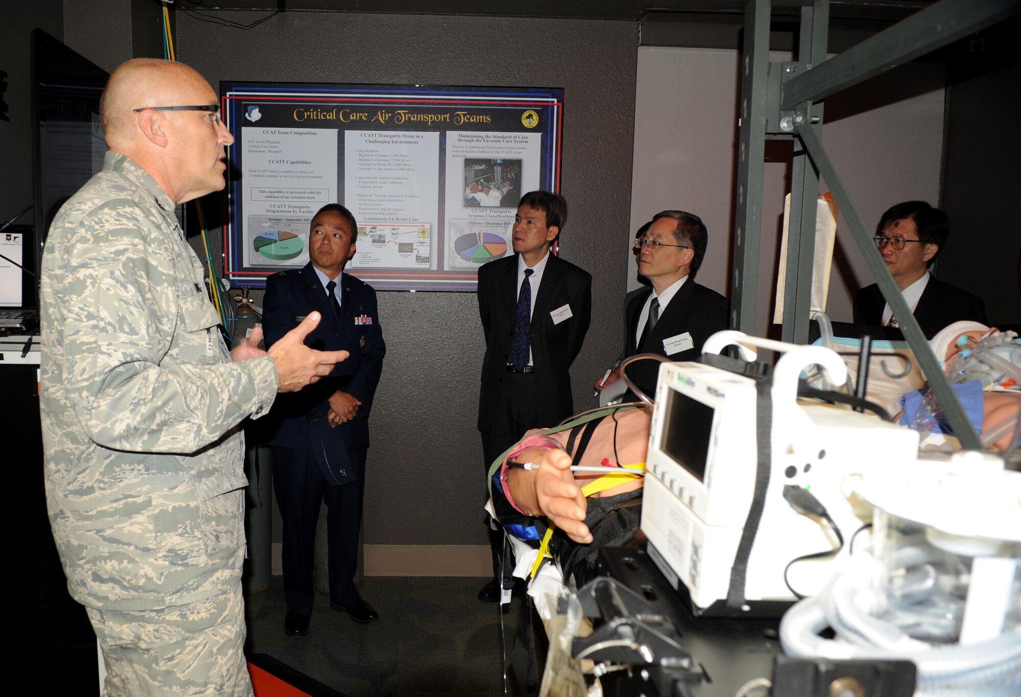 Lt. Gen. Deh-Ming Chang and members of his team are briefed on the Critical Care Air Transport Team by U.S. Air Force Col. James King at Wilford Hall Ambulatory Surgical Center May 15 at Lackland Air Force Base, Texas.  Chang is Director General of the Medical Affairs Bureau of Taiwan visiting to learn about the San Antonio Military Health System and King is chief of the department of Emergency Medicine, San Antonio Military Medical Center, Fort Sam Houston, Texas. (U.S. Air Force Photo/Staff Sgt. Micky M. Bazaldua)